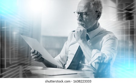 Businessman checking a document in office; multiple exposure