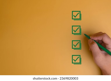 Businessman checking mark on the check boxes with marker green. Tick Checklist form feedback, satisfaction, exam on background concept. - Powered by Shutterstock