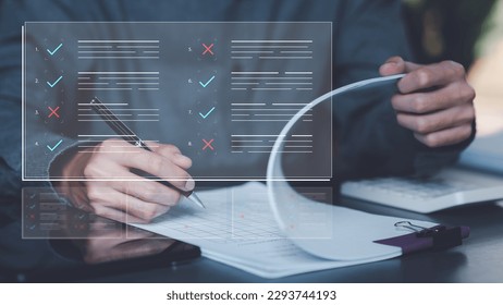 Businessman checking the steps through document with a list of checkboxes ,regulation ,Concepts of practices and policies , procedure company articles of association Terms and Conditions