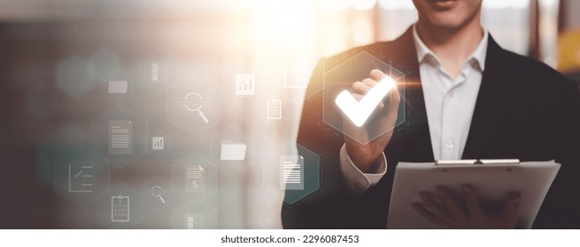 Businessman checking steps through online document with list of checkboxes ,regulation ,Concepts of practices and policies , procedure company articles of association Terms and Conditions - Shutterstock ID 2296087453