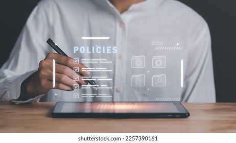 Businessman checking the steps through a virtual online document with a list of checkboxes Concepts of practices and policies, company articles of association Terms and Conditions,Privacy Policy  - Shutterstock ID 2257390161