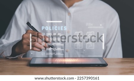 Businessman checking the steps through a virtual online document with a list of checkboxes Concepts of practices and policies, company articles of association Terms and Conditions,Privacy Policy 