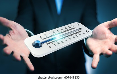 Businessman checking the temperature drop with a thermometer