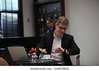 Businessman Checking A Travelling Passport. Passengers In Lounge  International Airports. Exclusive Room