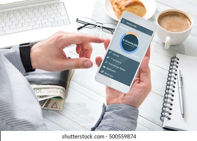 Businessman Checks The Account Balance At Breakfast