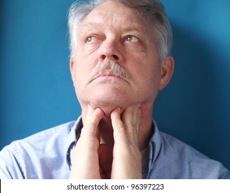 Businessman Checks For Swelling In The Lymph Glands In His Neck