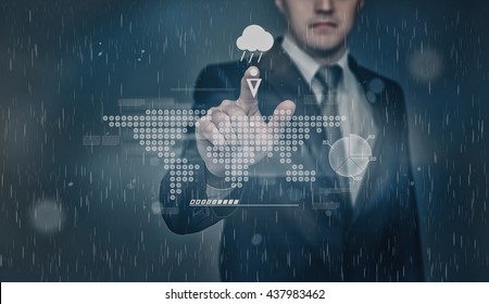 Businessman checks weather forecast. Touching the touch screen with the projection of graphic world map representation. Chance of precipitation as rain. Innovative technology. Digital presentation