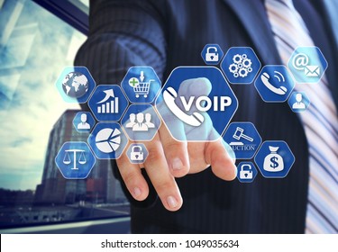 The businessman chooses VOIP on the virtual screen in social network connection. 