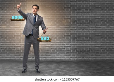 Businessman Choosing Between Good And Bad