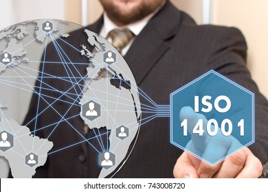 The businessman is choosing ISO  14001 on the touch map of the world