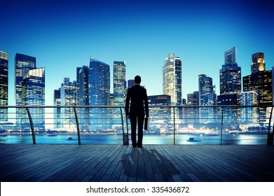 Businessman Cityscape Skyline Night Light Vision Concept - Powered by Shutterstock