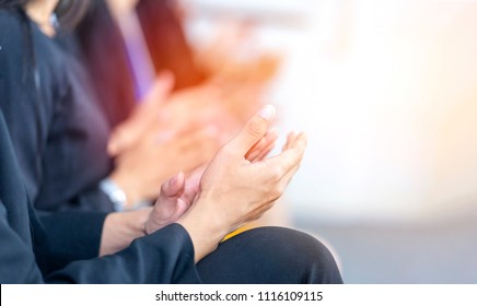 Businessman clapping hands during seminar or teamwork meeting. Congratulation to  team member who receives award after business project success. Succeed from team collaboration, diversity idea, unity - Powered by Shutterstock