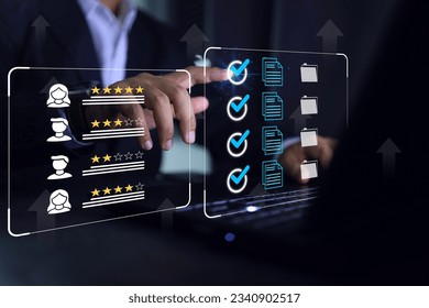 Businessman click blue check mark on laptop screen to vendor evaluate or supplier feedback industrial facility and rated a maximum of five stars according to the ISO documentation management system. - Shutterstock ID 2340902517