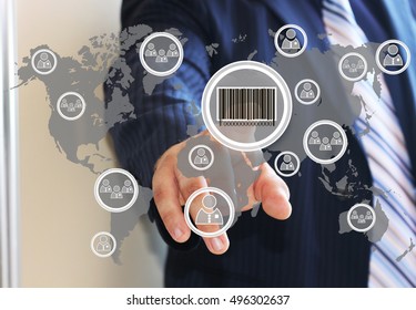 Businessman clicking on the product barcode on the touch panel with a map of the world. Web icons.
