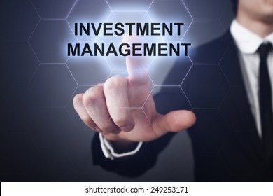 Businessman Clicks On Virtual Touchscreen Display And Select Investment Management