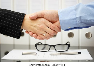 Businessman and client are handshaking over very good agreement - Shutterstock ID 387274954