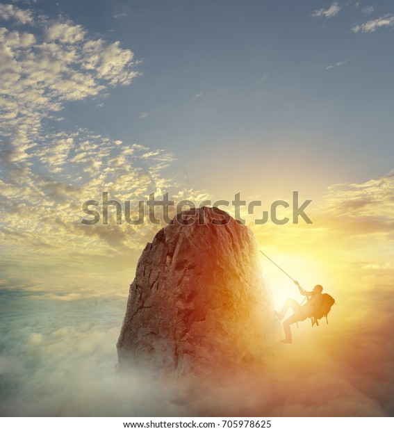 Businessman climb a mountain to\
get the flag. Achievement business goal and difficult career\
concept