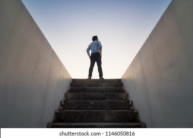 Businessman climbed on top of the stairs going to the city,  Ambitions concept and Success business. - Shutterstock ID 1146050816
