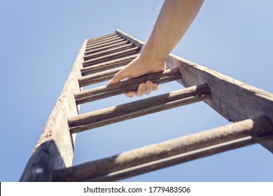 Businessman climbing the corporate ladder of success