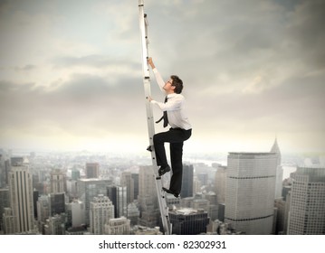 Businessman climbing up a ladder with cityscape in the background