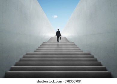 Businessman climbing stairs ,Ambitions concept .