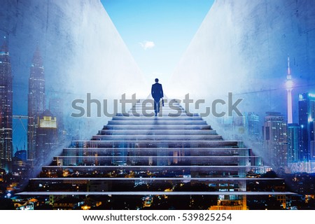 Businessman climbing stairs to get to a large city center. Concept of success . Double exposure,rear view,night scene .