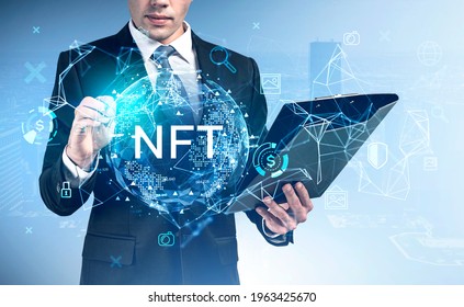 Businessman with clipboard pen touching at non-fungible token hologram, double exposure, nft with earth globe and network icons, city view on skyscrapers. Concept of cryptocurrency - Powered by Shutterstock