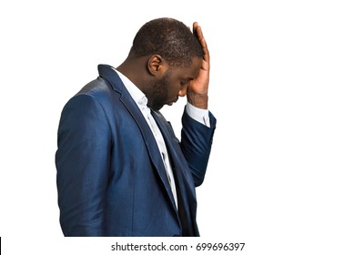 Businessman With Closed Eyes And Headache. Beard Black Manager Touching His Head With Hand, Side Photo. Dissapointed And Frustrated Afro American Businessman Feeling Headache.