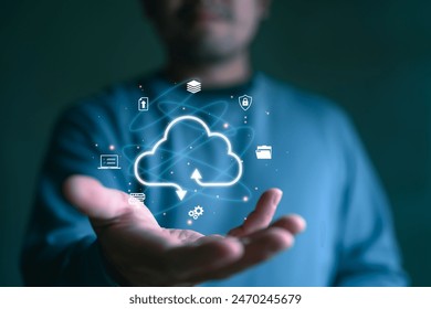 Businessman with cloud computing diagram show on virtual screen. Cloud technology. Data storage. Networking and internet service concept.