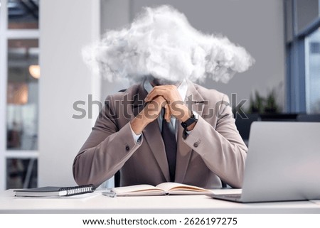 Businessman with cloud instead of head at table in office. Mental health