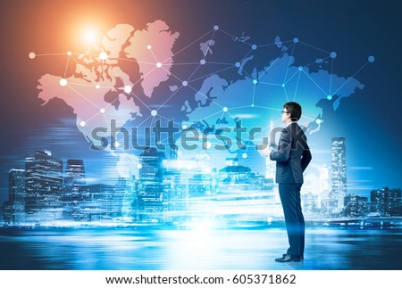 businessman with a coffee cup looking at a network sketch drawn on a world map on a glassboard