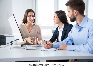 Businessman with colleagues at a presentation in the office - Shutterstock ID 739212859
