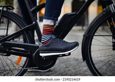 Businessman commuter on the way to work, close up of his legs riding bicycle. - Powered by Shutterstock