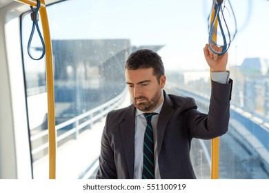 Businessman Commuter Is Traveling And He Is Sad And Tired