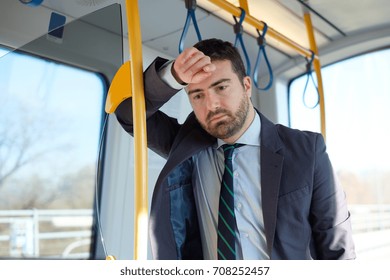 Businessman Commuter Is Traveling And He Is Sad And Tired