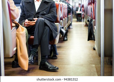 Businessman Commuting On A Train