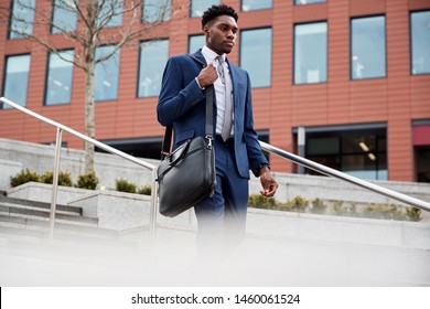 Businessman Commuting To Work Walking Down Steps To Railway Station - Powered by Shutterstock