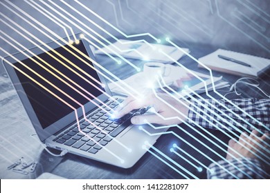 Businessman with computer background with technology theme hologram. Concept of hightech. Multi exposure.