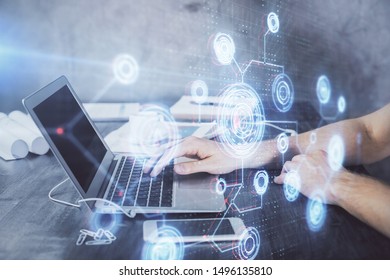 Businessman with computer background with technology theme hologram. Concept of hightech. Multi exposure. - Shutterstock ID 1496135810