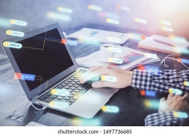 Businessman with computer background with technology theme hologram. Concept of hightech. Multi exposure.