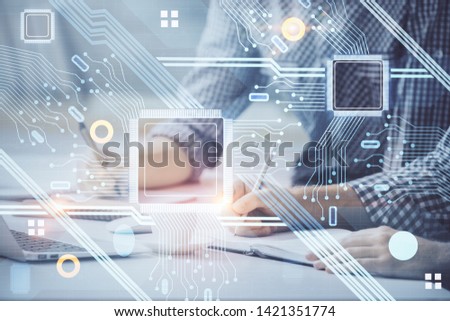 Businessman with computer background with technology theme hologram. Concept of hightech. Multi exposure.