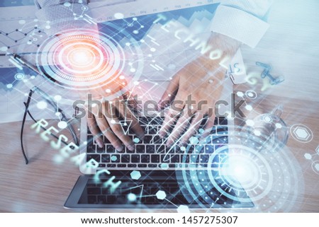 Businessman with computer background with technology theme hologram. Concept of big data. Double exposure.