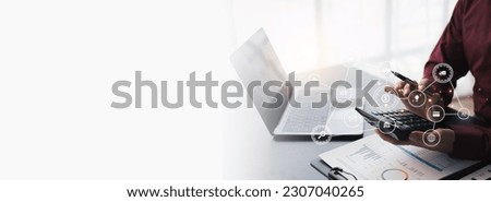 Businessman computing historic data to predict stock market behaviour. Internet trading concept. Forex and financial hologram chart over the desk and calculator. Stock market crash.