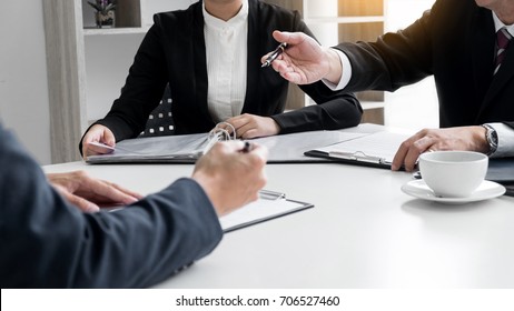 Businessman conducting an interview with businessman in an office. - Powered by Shutterstock