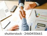 Businessman conducts financial discussions, sealing deals with handshakes. Expert in accounts, loans, mortgages, interest rates, credit scores, savings, checking, stocks, bonds, mutual funds