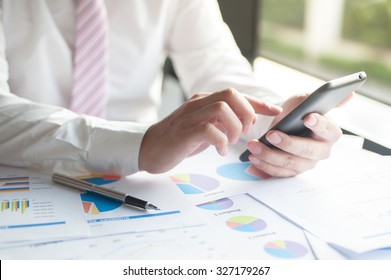 Businessman conference on mobile phone with modern devices, smart phone or mobile phone.