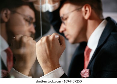 Businessman in conference room use sticky notes on glass wall. Handsome businessman making a business plan.