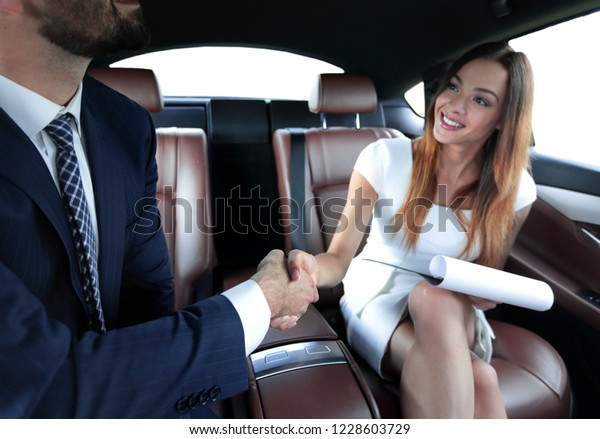 Businessman was congratulated in the car for
completing the job