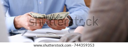 The businessman considers cash dollars in the office issues salaries to employees with black cash divides the profits as a result of illegal transactions everyone is happy.