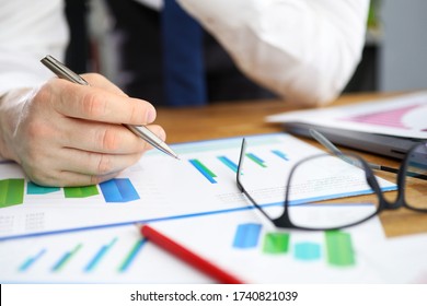 Businessman considers financial report corrections. Indicators in context existing advertising campaigns. Data from different sources on one screen. Setting specific goals and objectives